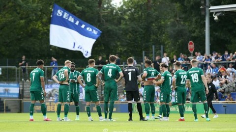 柏林夏夜绿茵对话 赫塔与吕贝克握手言和