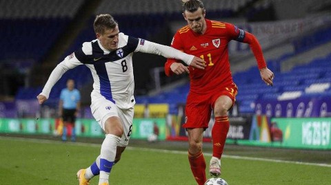 红龙高飞，挺进A级：回顾威尔士战火洗礼下的晋级之夜